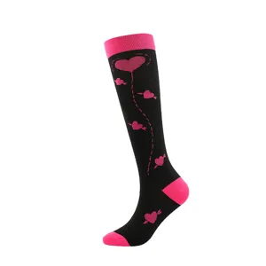 Valentine's Day black compression socks with pink heart pattern and balloon design