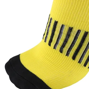 Detailed close-up of yellow and black striped athletic compression socks showing fabric texture