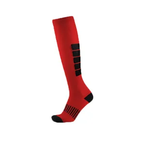 Detailed macro view of red high-tube compression sports socks with black stripe pattern.