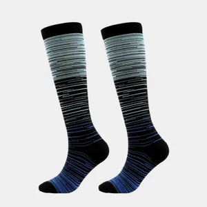 Detailed macro shot of blue and black gradient striped compression socks for sports