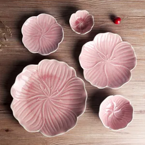 Exquisite Japanese ceramic tableware set featuring pink flower petal plates with crackle glaze
