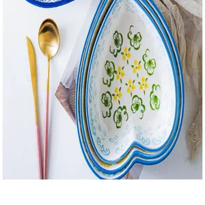 Elegant heart-shaped ceramic nesting bowls with floral patterns for desserts and salads