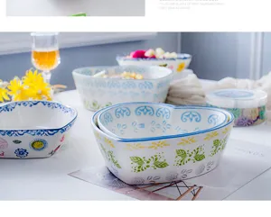 Detailed view of heart-shaped ceramic bowls with colorful hand-painted floral patterns