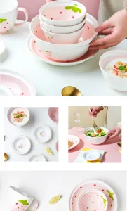 Detalle de la vajilla de cerámica con motivo de fresas, incluyendo cuencos y platos