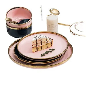 Elegantes Set aus rosa und dunkelblauem Keramikgeschirr mit Goldrand, modernes Geschirrset