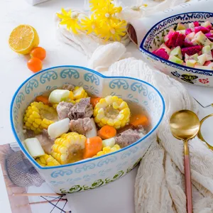 Heart-shaped Japanese style ceramic bowl for salad and dessert in a lifestyle setting.
