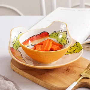 Ensemble de bol et assiette en céramique peints à la main avec un motif de carotte
