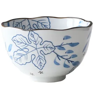 Japanese style ceramic bowl with wavy rim and blue leaf underglaze pattern design
