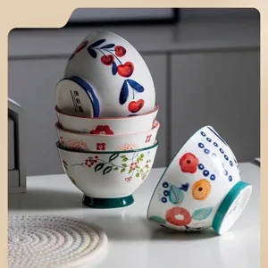 Hand-painted Japanese style conical ceramic rice bowl with floral patterns