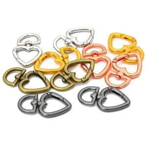 Macro view of colorful alloy heart-shaped spring clasps for DIY jewelry accessory kit