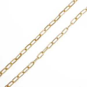 Close-up macro detail of polished gold iron paperclip chain links for DIY jewelry making