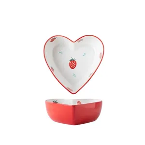 Japanese heart-shaped ceramic dessert bowl with strawberry pattern and red exterior