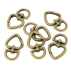 Detail view of heart-shaped alloy spring clasps for DIY handmade jewelry keychain making