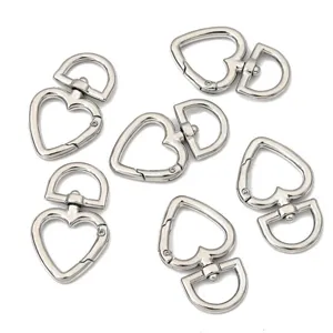 Detailed macro view of silver alloy heart-shaped spring clasps for DIY jewelry and keychains