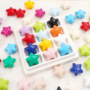 Detailed view of vibrant glossy acrylic star beads organized in a white display tray