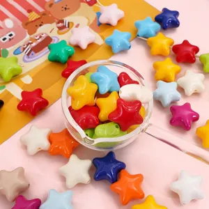 Close-up of colorful glossy acrylic star beads for handmade DIY jewelry crafting