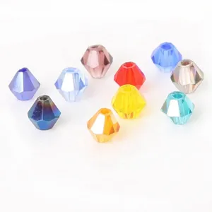 Close-up of various colorful bicone faceted crystal beads showing intricate light refraction