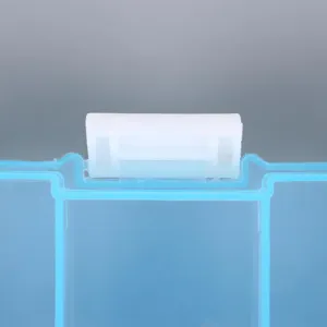 Macro view showing the white latch mechanism on a blue translucent plastic storage box
