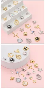 Macro view of vintage alloy charms in planet, heart, and star shapes for DIY jewelry crafting