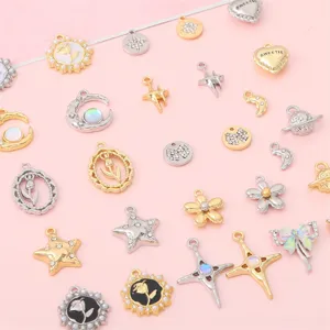 Assorted vintage alloy charms in heart, star, and planet shapes for DIY jewelry.