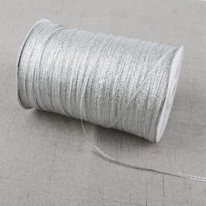 High-quality detail view of a silver metallic glitter ribbon roll for various DIY crafts