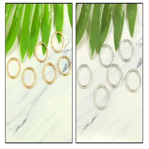 Detail view of iron twisted jump rings in gold and silver for DIY jewelry making