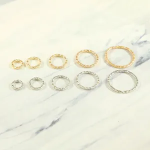 Assorted sizes of twisted metal jump rings for DIY jewelry making in gold and silver