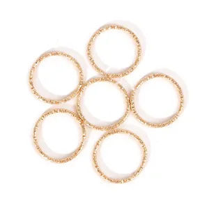 Set of golden iron twisted open jump rings for DIY jewelry making and earring accessories.