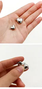 Close-up view of heart-shaped stainless steel magnetic jewelry connectors for DIY crafts