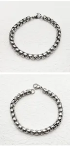 Close-up view of a durable stainless steel box chain bracelet with a secure lobster clasp