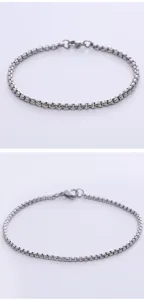 Detailed view of a minimalist silver box chain bracelet with a secure lobster clasp.