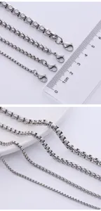 Detail view of various stainless steel box chain sizes with measurement ruler
