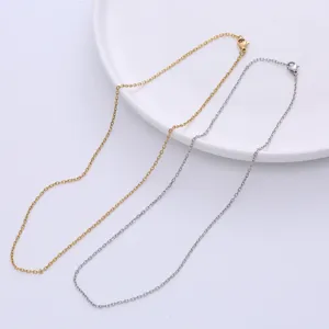 Detailed view of minimalist gold and silver faceted cross-link necklace chains