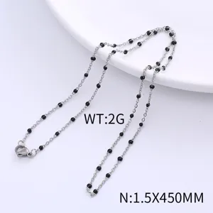 Minimalist stainless steel necklace featuring small black enamel beads, bohemian style chain