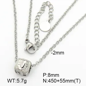 Detailed macro view of silver stainless steel initial J pendant necklace with size markers
