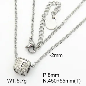 Close-up detail of a silver-toned stainless steel cube pendant necklace with engraved letter T