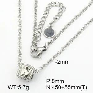 Macro view of stainless steel cube pendant necklace with letter W engraving