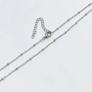 Detailed close-up of a silver stainless steel satellite bead chain with a lobster clasp.