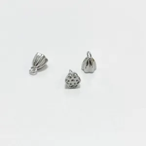 Detailed macro shot of three silver-colored stainless steel lotus seed pod charms.