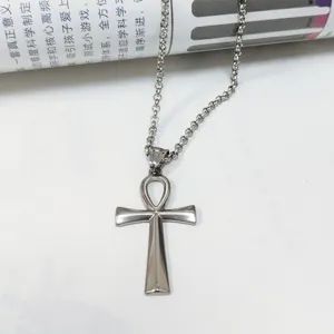 Close-up detail of a vintage silver stainless steel Ankh cross pendant necklace for men
