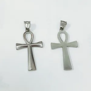 Detail view of two silver stainless steel Ankh cross pendants with different finishes.