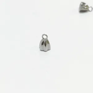 Close-up of small stainless steel lotus pod pendant for jewelry DIY projects