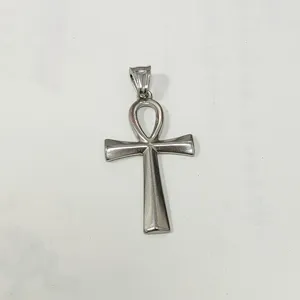 Detailed macro view of a silver polished stainless steel Egyptian Ankh cross pendant