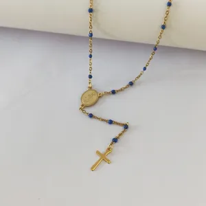 Detailed view of religious gold stainless steel rosary necklace with blue enamel beads