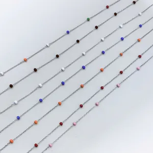 Detailed view of colorful enamel bead stainless steel necklaces in rainbow candy colors