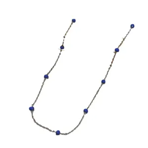 Minimalist stainless steel necklace with vibrant blue beads in a bohemian candy color style.