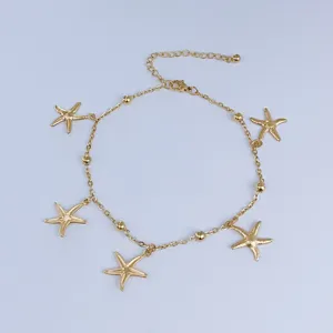 Detailed view of a gold stainless steel anklet featuring five elegant starfish charms