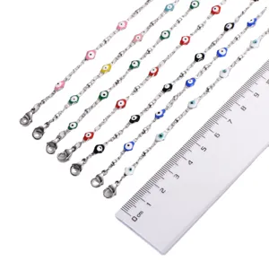 Braccialetti in acciaio inossidabile con ciondoli malocchio colorati e chiusura a moschettone