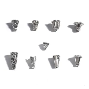 Vue détaillée de divers capuchons de glands en alliage d'argent antique pour bijoux DIY