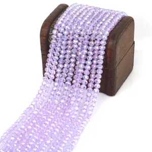 4mm faceted lavender glass crystal rondelle beads for DIY jewelry making on wooden chest